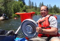 rafter cleaning up the South Fork American River